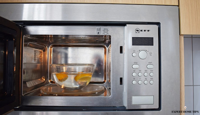 cleaning microwave with lemons