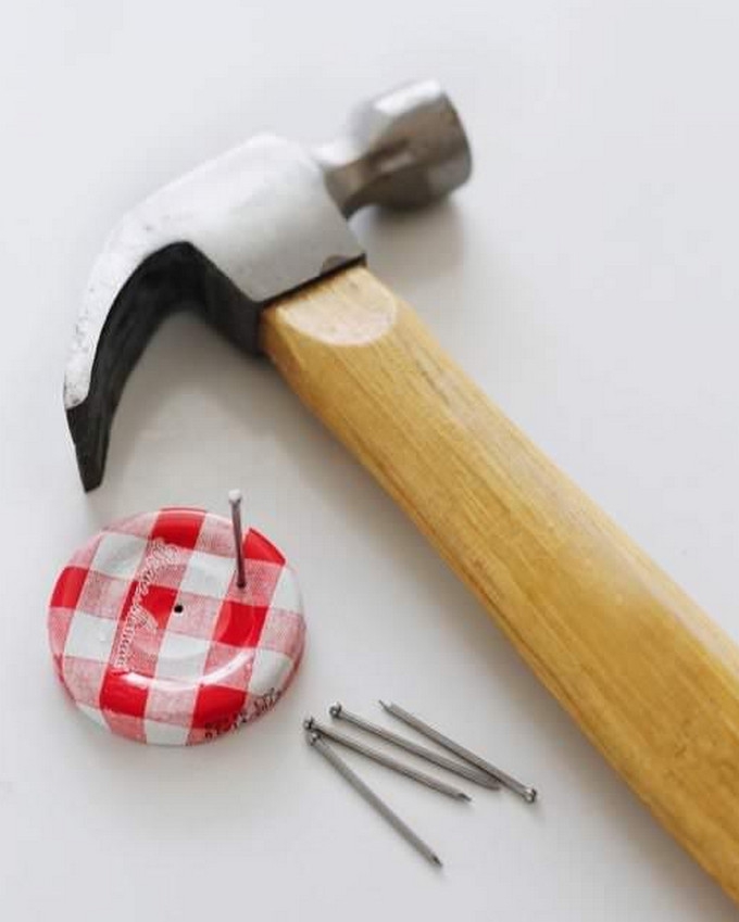 Punch holes into your jam lids.