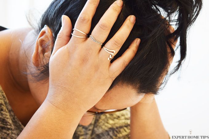 woman holding head